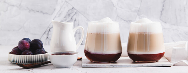 Homemade berry latte in glasses on the table web banner