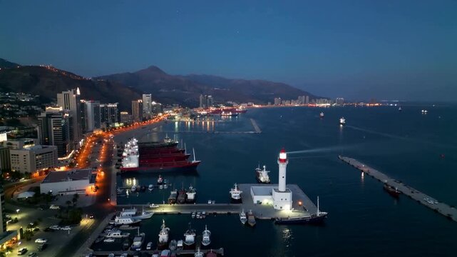Panoramic aerial night view of Jeddah port and lighthouse in Saudi Arabia