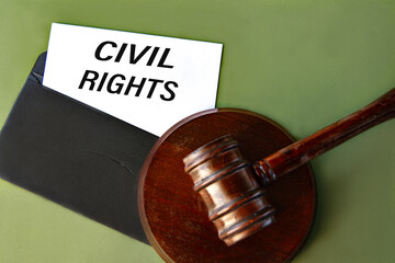 Black envelope with the text CIVIL RIGHTS and the judge's gavel on a green background