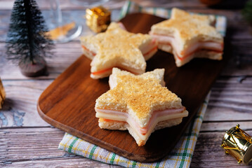 Ham tomato and cheese canape sandwiches in the form of star for Christmas holidays