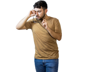 Tired man rubbing eyes and holding eyeglasses on white background. PNG