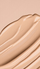 Foundation, concealer, face makeup smudge, smears border. Cosmetic liquid foundation or cream beige color smudges, stroke. Contouring, Make up background. Foundation texture surface, bb, cc cream