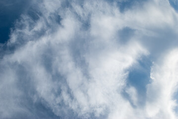 white clouds in a soft blue sky