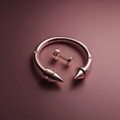 Rose gold circular bracelet and stud earring with sharp points on a smooth, matching surface