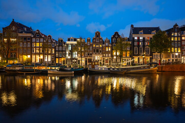 Reflections on an Amsterdam canal at night