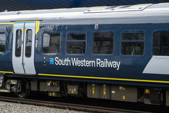 Reading, UK - August 21, 2025; South Western Railway name and logo on side of passenger train
