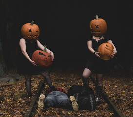 Dark Halloween scene with pumpkin heads and a mysterious atmosphere in an abandoned setting