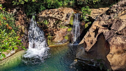 Obraz premium Twin Las Chorreras Waterfalls near Rincon National Park in Costa Rica. These falls, along with their pool at the bottom, are a popular place to swim.