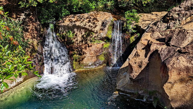 Twin Las Chorreras Waterfalls near Rincon National Park in Costa Rica. These falls, along with their pool at the bottom, are a popular place to swim.
