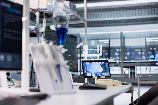 Tablet in lab with app interface showing genetic markers associated with disease risk. Digital device in laboratory used to study DNA strand mapping with genomics analysis program - Powered by Adobe