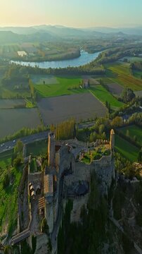  Mornas Fortress stands majestically on top of a rocky cliff. The Fortress of Mornas is a medieval fortress above the village of the same name in the French department of Vaucluse