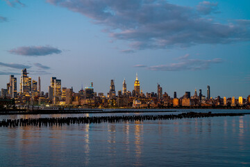 Fototapeta premium New York City. NYC cityscape with skyscrapers. Panoramic of New York City skyline. Manhattan skyline. New York and Hudson River. Downtown NYC. New York skyscrapers. The business district of NYC.