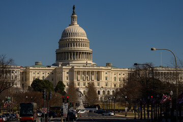 Fototapeta premium Washington DC Capitol building. Congress on Capitol Hill in Washington DC. American flag over Capitol. Washington DC landmark. Senate and House in Washington D.C..