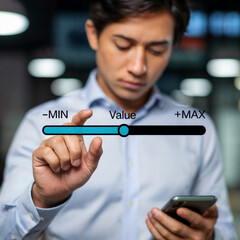 Asian businessman adjusts value slider min max scale blue shirt office lighting smartphone hand stock photo
