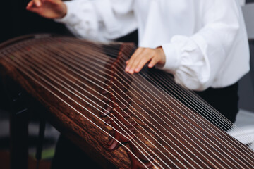 Traditional Korean folk musical instrument Gayageum, female orchestra band performing concert on Kayagum in of Seoul, South Korea, wooden zither with 12 strings, Koto or Guzheng live music performance