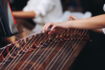 Traditional Korean folk musical instrument Gayageum, female orchestra band performing concert on Kayagum in of Seoul, South Korea, wooden zither with 12 strings, Koto or Guzheng live music performance