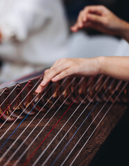 Traditional Korean folk musical instrument Gayageum, female orchestra band performing concert on Kayagum in of Seoul, South Korea, wooden zither with 12 strings, Koto or Guzheng live music performance