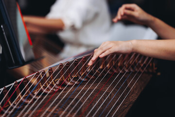 Traditional Korean folk musical instrument Gayageum, female orchestra band performing concert on Kayagum in of Seoul, South Korea, wooden zither with 12 strings, Koto or Guzheng live music performance