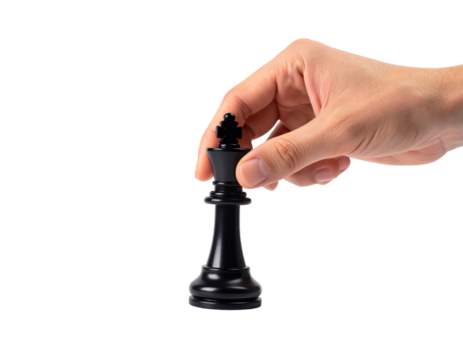 Close-up of a hand using a precision grip to lift or place a black chess King piece by its cross top, showing a strategic move, isolated against a light gray background.