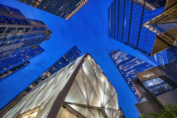 New York City - June 13, 2025: Urban perspective of high-rise buildings in Hudson Yards showcasing contemporary architecture at night