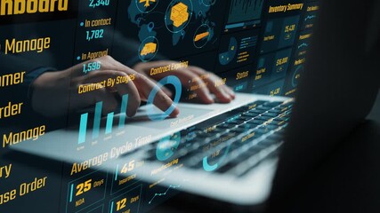 A close-up view of hands typing on a laptop displaying a digital management dashboard, showcasing data analytics and modern business operations in a warehouse setting. Cipher - Powered by Adobe