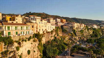 Fototapeta premium Scenic aerial panorama of Tropea cityscape and coastline with cliffs and clear waters