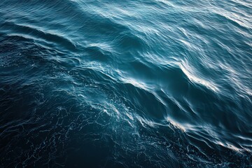 Fototapeta premium Aerial View Of Rippled Ocean Surface With Sparkling Light Reflections in Shades of Blue