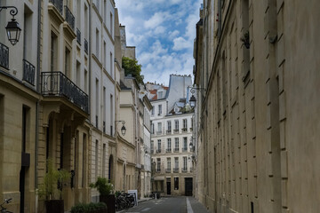 Paris, buildings in the Marais, in the center, in a typical street
