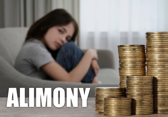 Sad little girl in room and stacked coins on table, selective focus. Money support for child after divorce, alimony