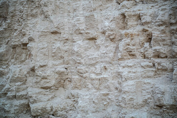 Close up view of a rock cliff with a rough texture