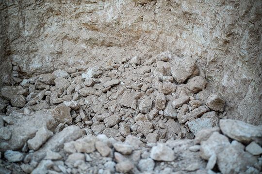 Pile of rock material from cliff excavation at construction site
