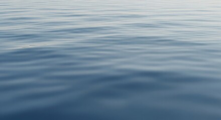 Calm Blue Water Surface with Gentle Ripples in Soft Sunlight