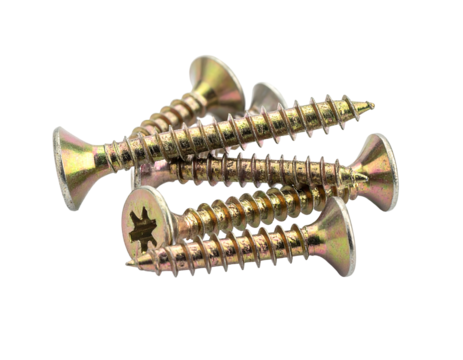 Golden screws are piled on a black background, showing crosshead details and sharp points, isolated