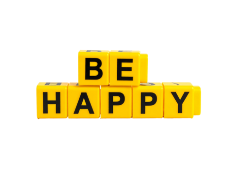 Be Happy" spelled with yellow toy blocks on black