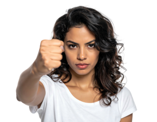 Focused woman with dark hair intensely extends a fist. Simple white shirt against isolated black background