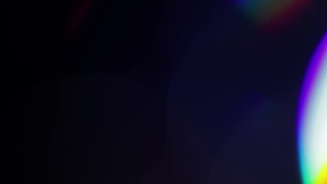Multicolored light leaks footage on black background, lens flare leak burst overlays transitions. 4k mov