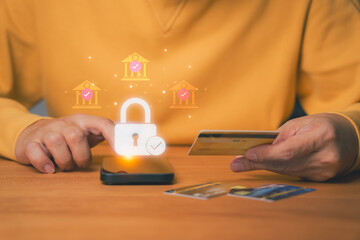 Person uses a smartphone for online banking with a padlock and bank icons, symbolizing secure...