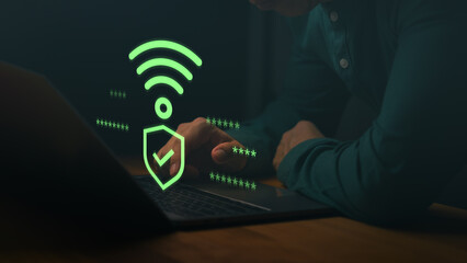 Man using a laptop computer with Wi-Fi security icon and checkmark, symbolizing safe internet...