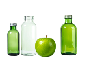 Four containers, two are green glass, one filled white, plus one green apple against a stark black background