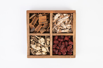 Assorted Dried Traditional Chinese Medicine Herbs in a Wooden Box