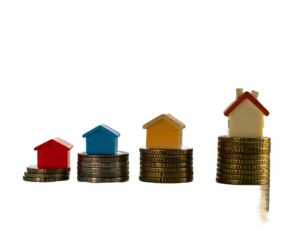 Stacked coins with toy houses, growing in height, on a dark background representing market increase