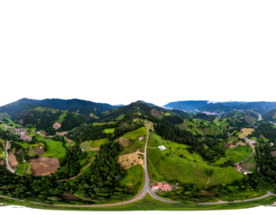 Sweeping panorama of green hills, valleys, & forests under a dark sky, shot from above, showing curvy road below