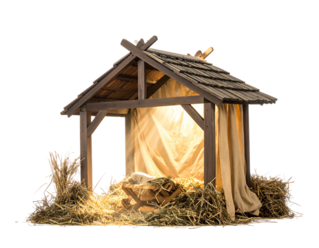 A rustic manger with straw and cloth is lit from within against a dark backdrop, evoking a serene scene