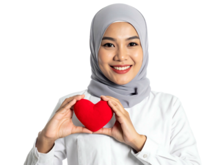 Smiling woman in hijab holds a red heart