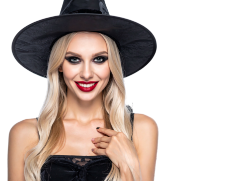 Smiling blonde woman in witch hat and black outfit against a black backdrop, looking directly at the viewer