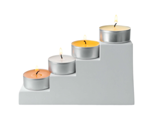 Four lit tea light candles sit atop a white, tiered candleholder, descending like steps, isolated on a black background