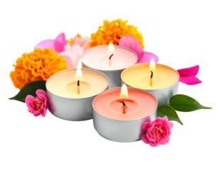 Four lit tea candles surround with pink and yellow flowers against a black background in a cozy, peaceful scene