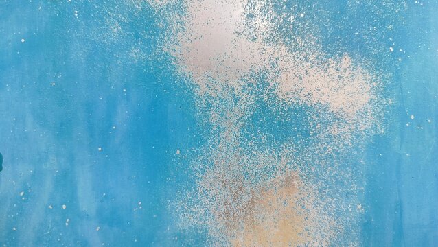 Background of an iron wall with faded blue paint because it is old and rusty. Blurred gray rusty grunge metal texture with Instagram style filter. Vintage effect.