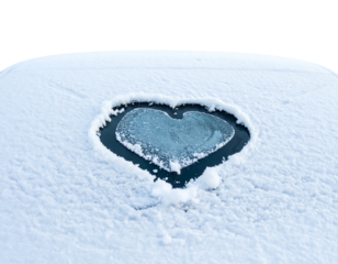 Snowy surface with a heart shape cleared, dark center, bright snow