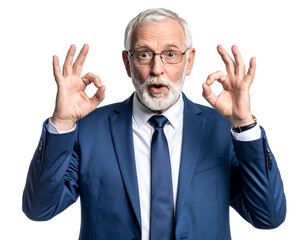 Ecstatic older man with beard in suit makes 'okay' hand gestures against a plain, dark background, looking at camera